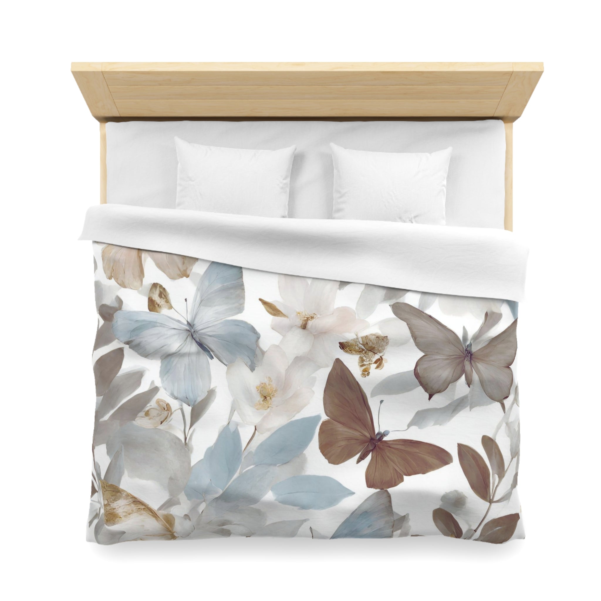 a bed with a floral print duvet cover featuring a design of butterflies and flowers.