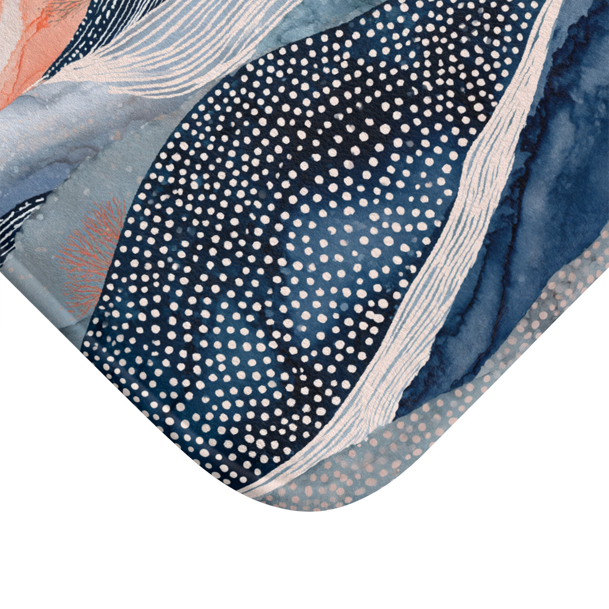 a close-up view of a patterned fabric or textile with a striking design. The design consists of a mix of blue, white, and orange colors, with a central element that appears to be a wave-like shape. The fabric has a textured appearance, with small white dots scattered throughout the pattern. The image does not contain any text or other discernible objects, and the focus is solely on the intricate and visually appealing design.