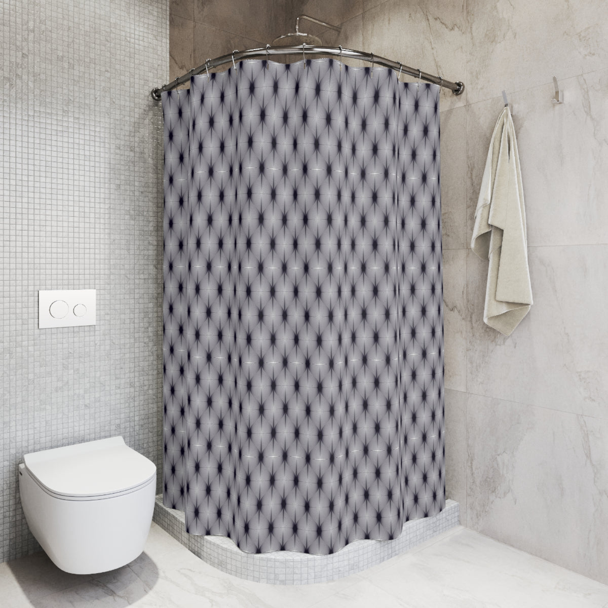 a modern bathroom with a shower curtain featuring a geometric pattern in shades of gray and black. The shower area is equipped with a curved shower head and a towel rack is mounted on the wall next to the shower.