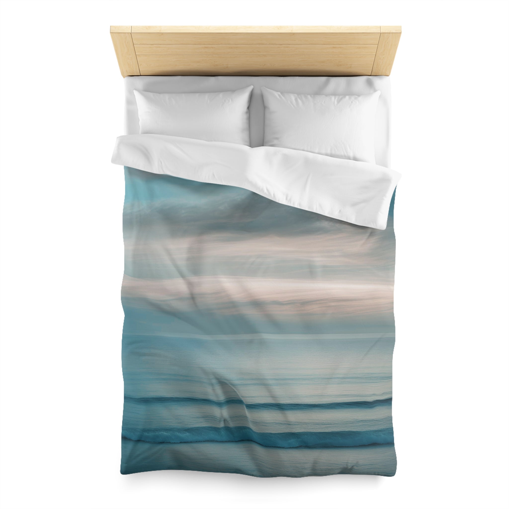a neatly made bed with a blue and white striped comforter and pillows.