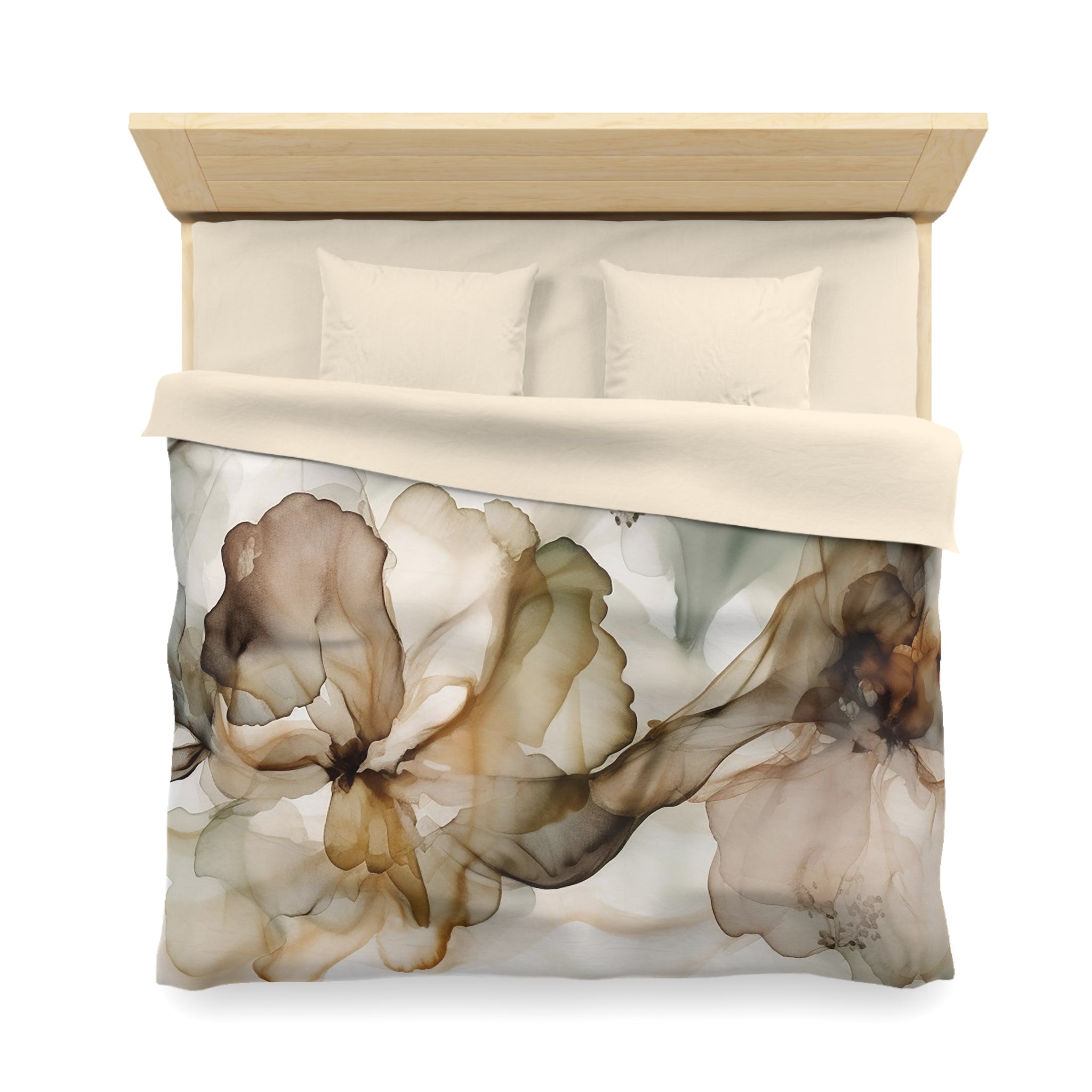 a bed with a floral print comforter and pillows.