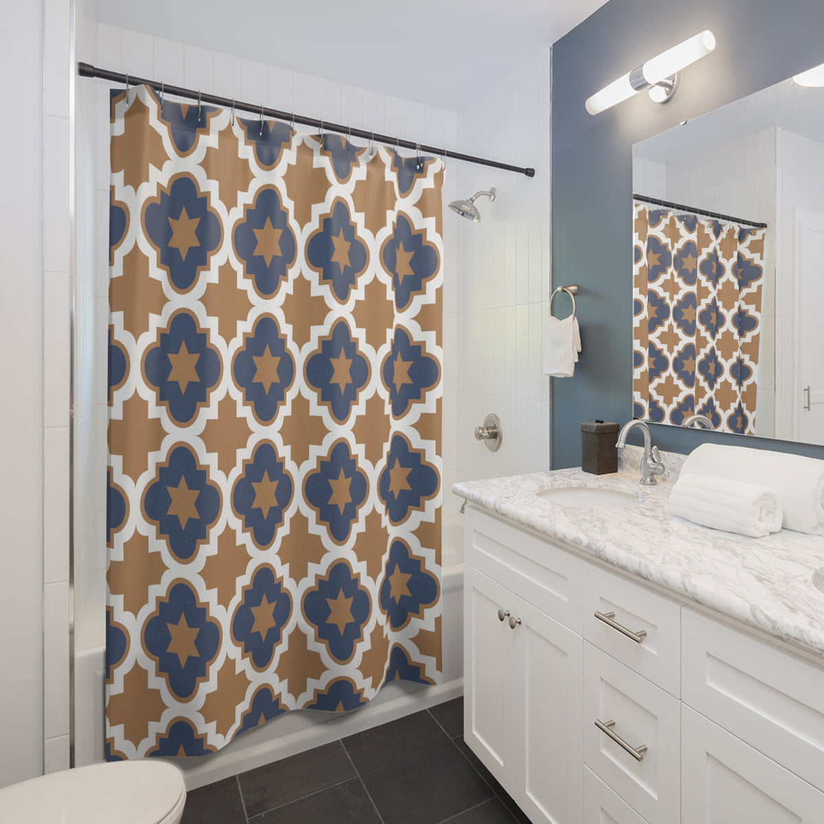 Close-up of navy and tan quatrefoil lattice with star centers on polyester fabric