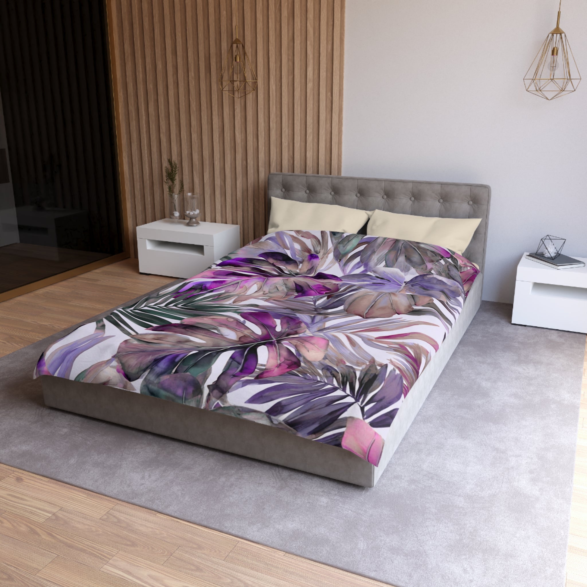 a modern bedroom with a large bed covered in a colorful, tropical-themed comforter. The bed is positioned against a wall with a wooden panel design. The room also includes a nightstand and a pendant light fixture, creating a cozy and stylish atmosphere.
