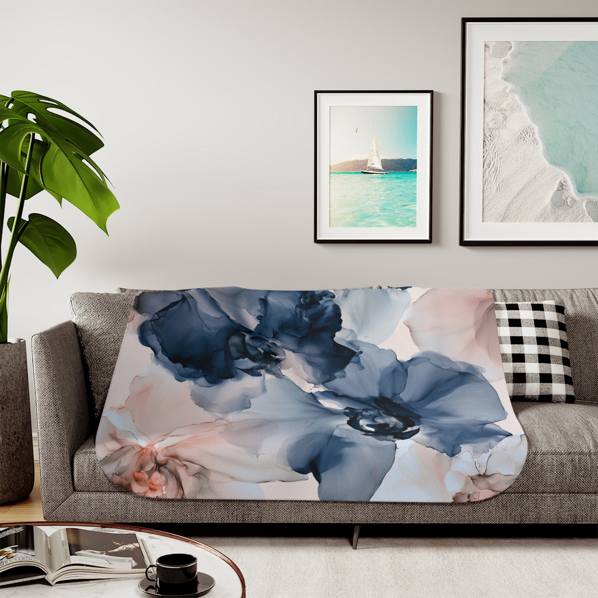 a living room with a couch, coffee table and pictures on the wall