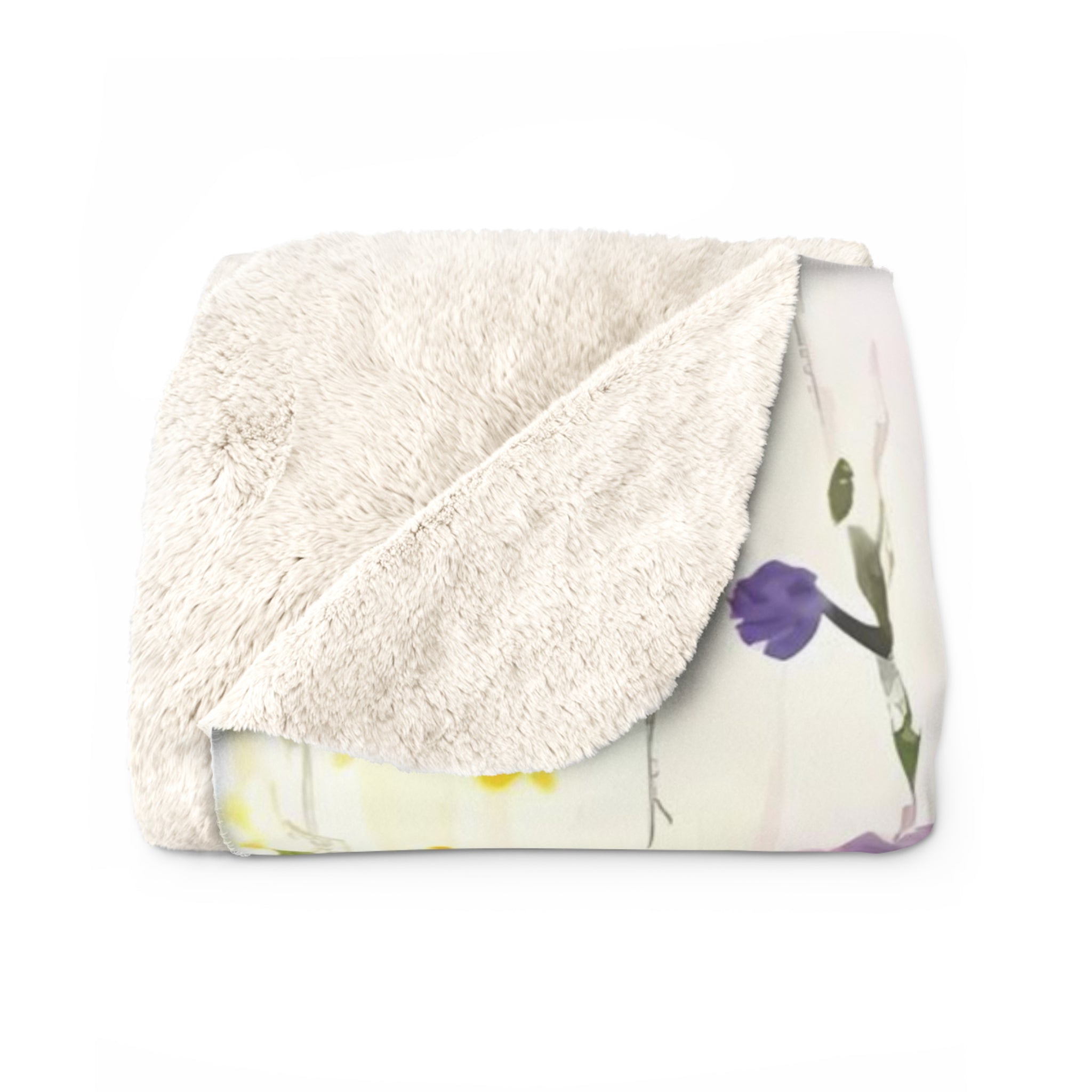 a white, fluffy blanket with a floral pattern on it.