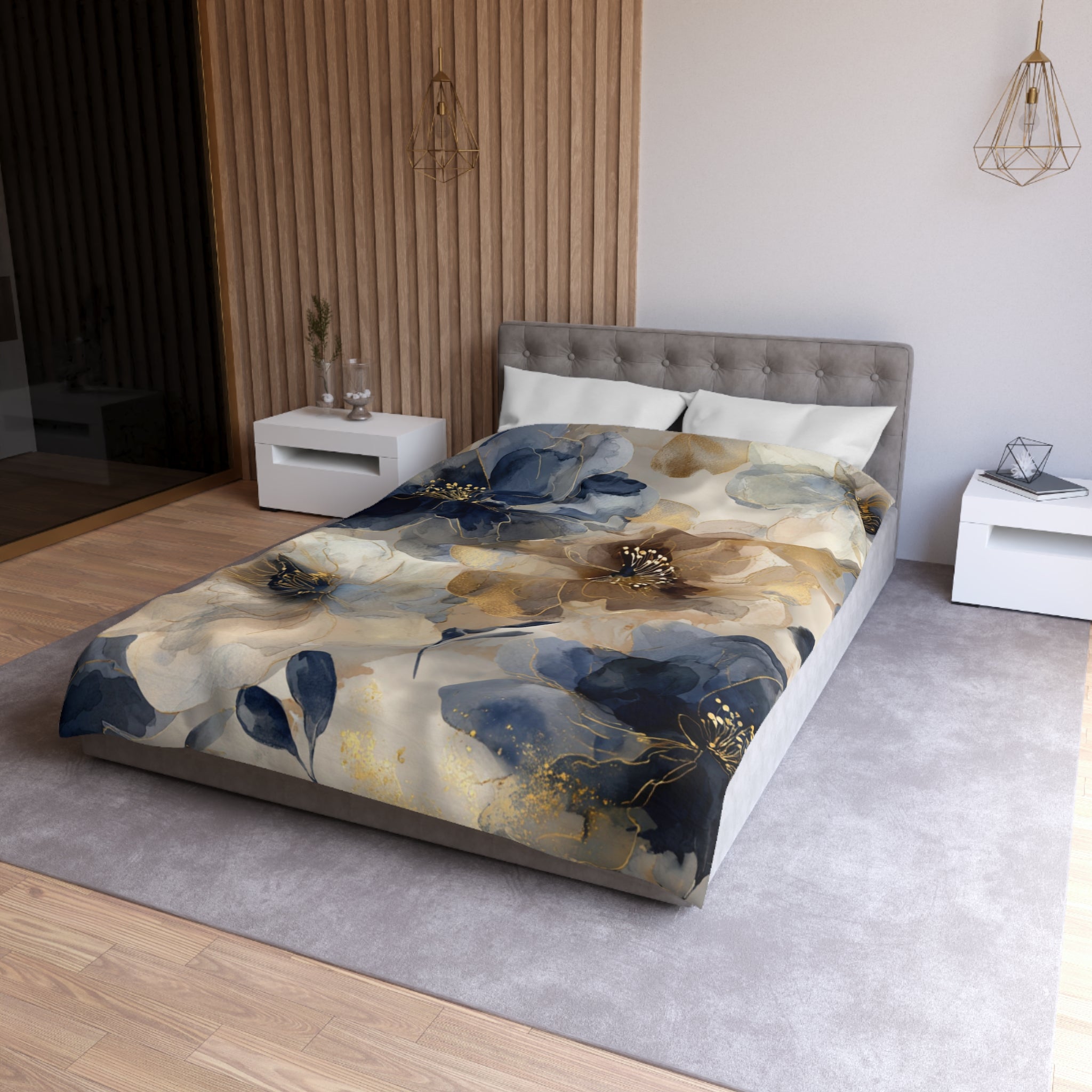 a modern bedroom with a large bed covered in a floral print comforter. The bed is positioned against a wall with a wooden panel design. The room has a neutral color scheme with white walls and a gray carpet. There are two nightstands on either side of the bed, and a pendant light hangs above the bed.