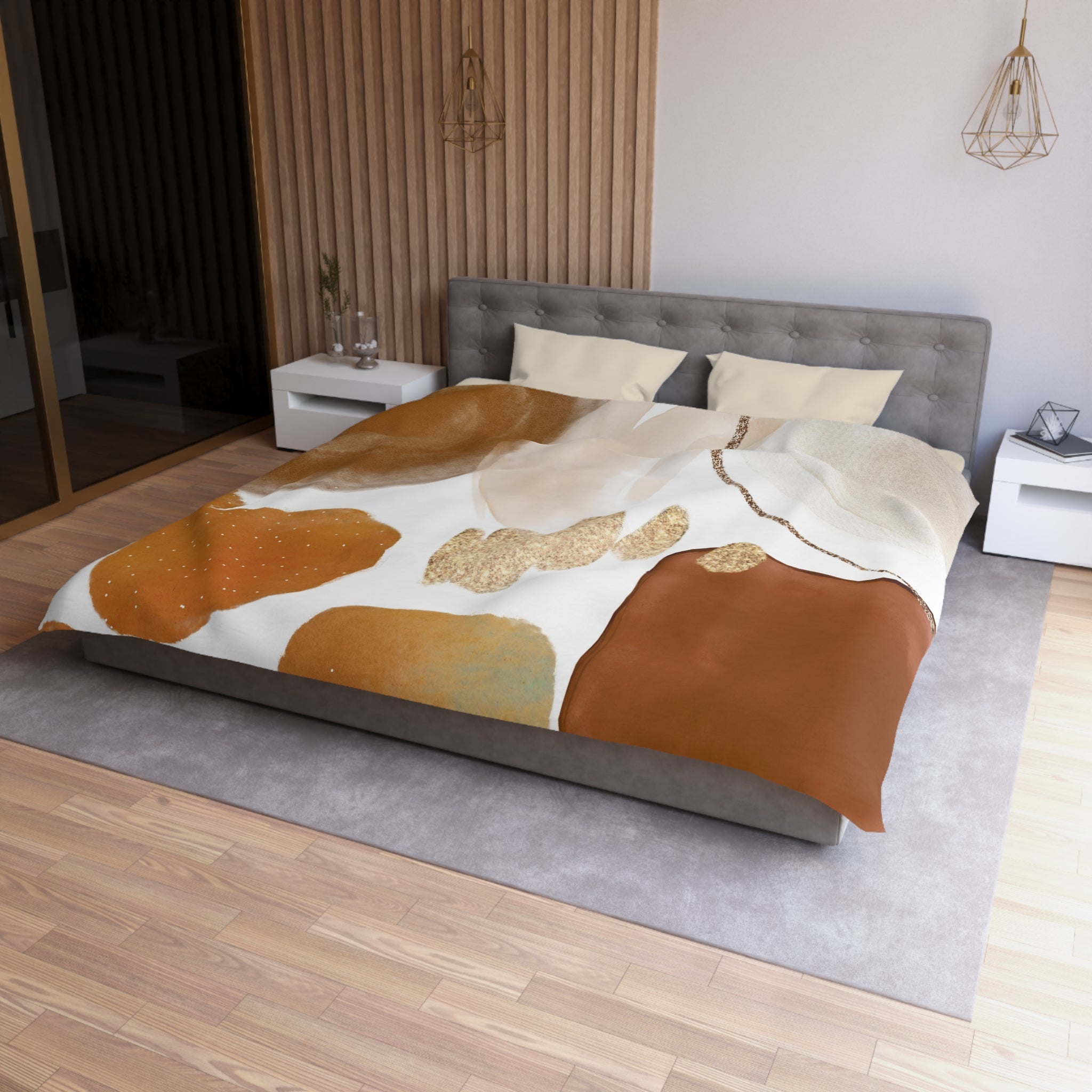 a modern bedroom with a large bed, a gray headboard, and a wooden floor. The bed is covered with a colorful, abstract-patterned comforter and pillows. There are two nightstands on either side of the bed, and a pendant light hangs above it. The room has a minimalist and stylish design, with a focus on natural materials and warm tones.