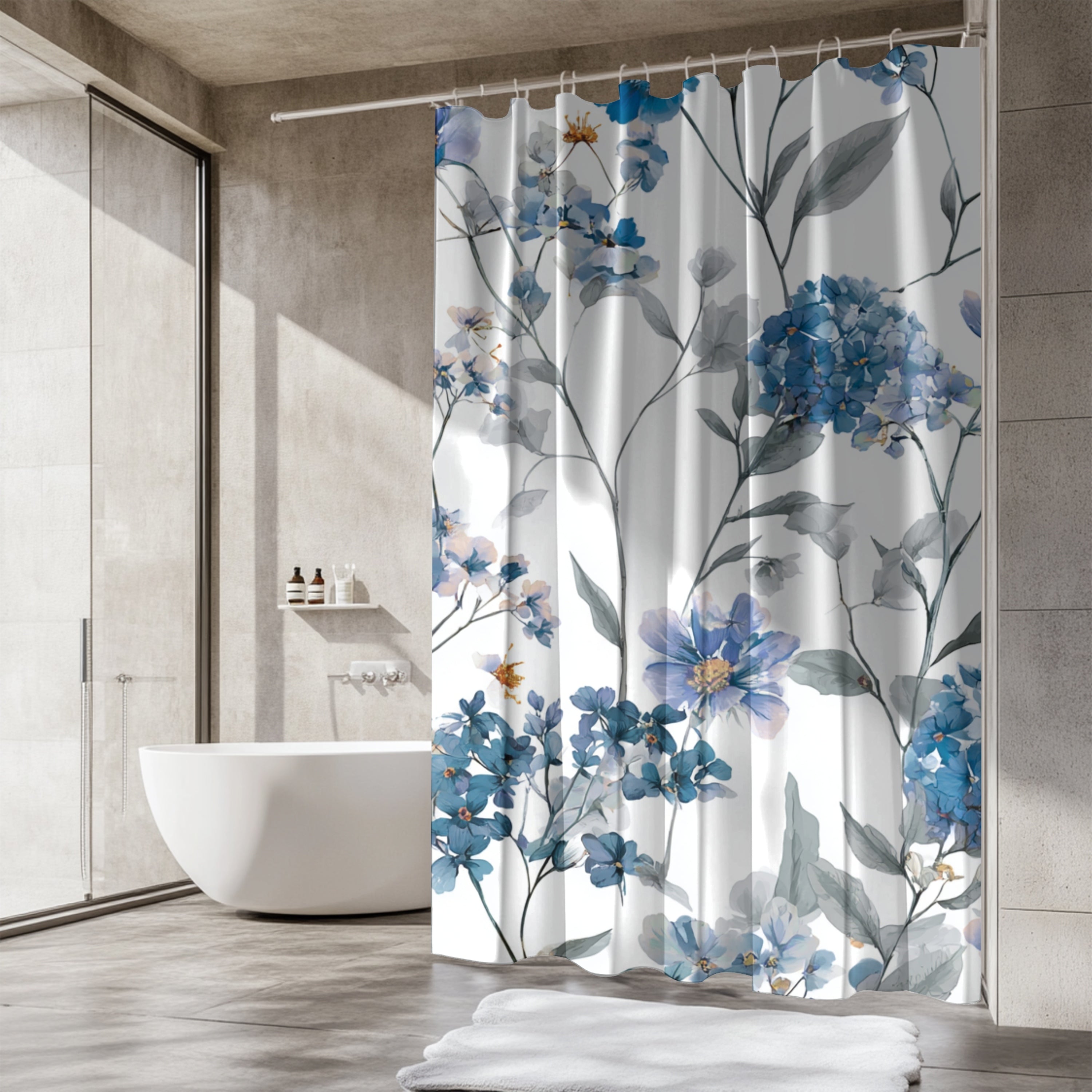a modern bathroom with a white bathtub and a shower curtain with a floral pattern in shades of blue and white.