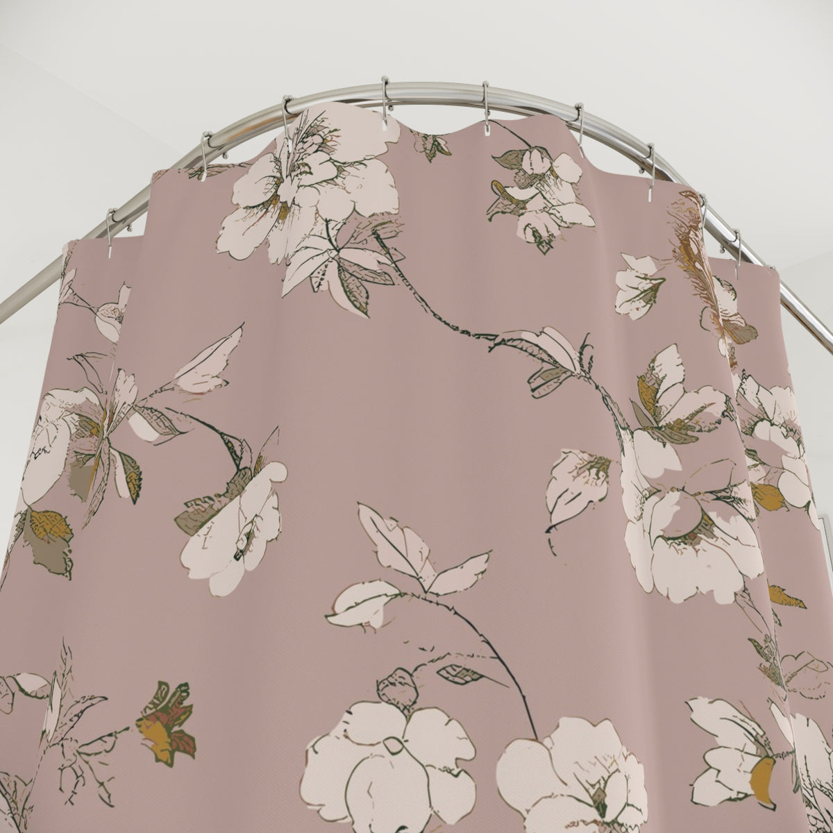 a shower curtain with a floral pattern, including white and green flowers and leaves.