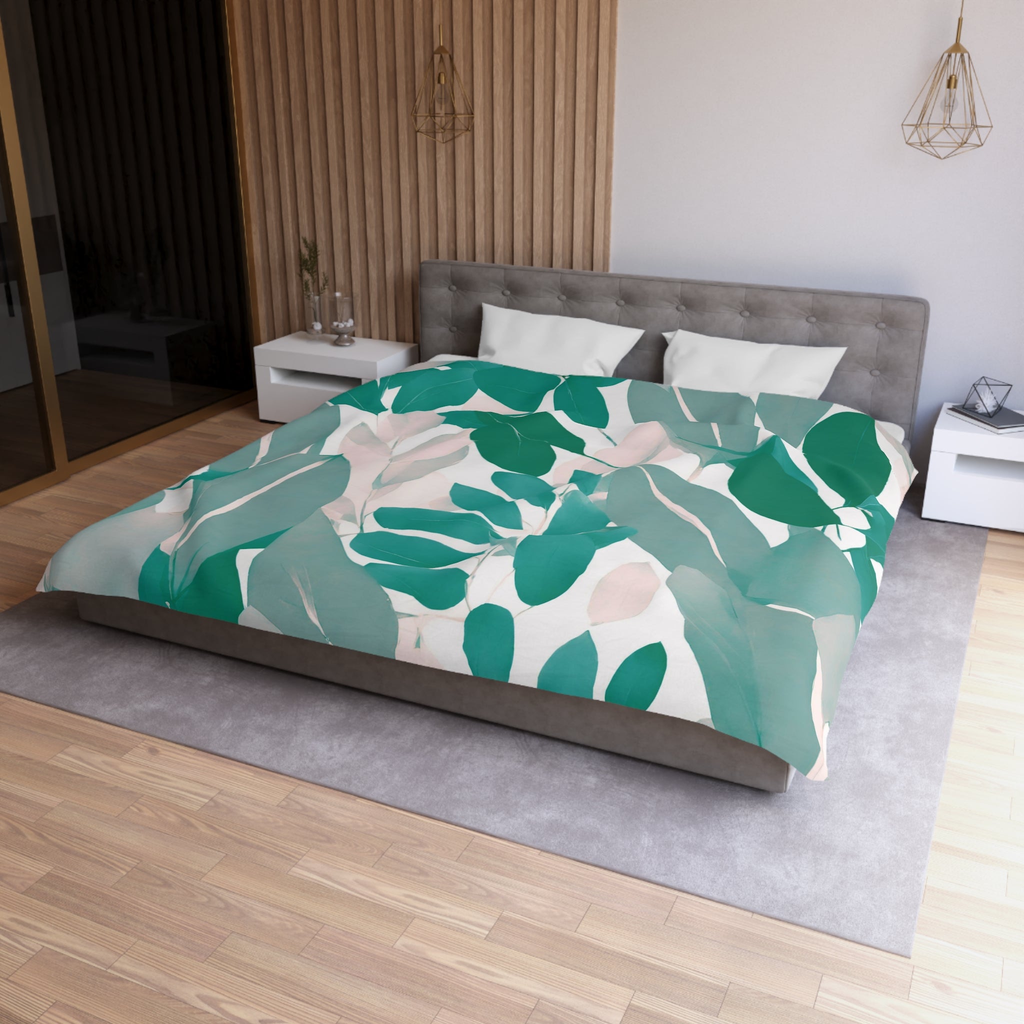 a modern bedroom with a large bed covered in a green and white leaf-patterned comforter. The bed is positioned against a wall with a wooden panel, and there are two nightstands on either side of the bed. The room has a minimalist and contemporary design, with a gray headboard and a gray carpet on the floor.