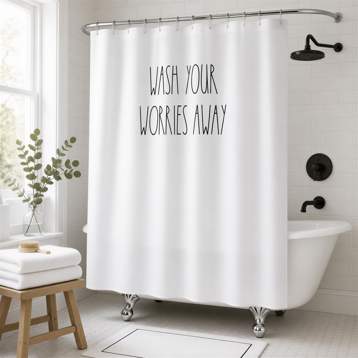 A bathroom with a white bathtub, a shower curtain with the text "WASH YOUR WORRIES AWAY" printed on it, and a potted plant nearby.