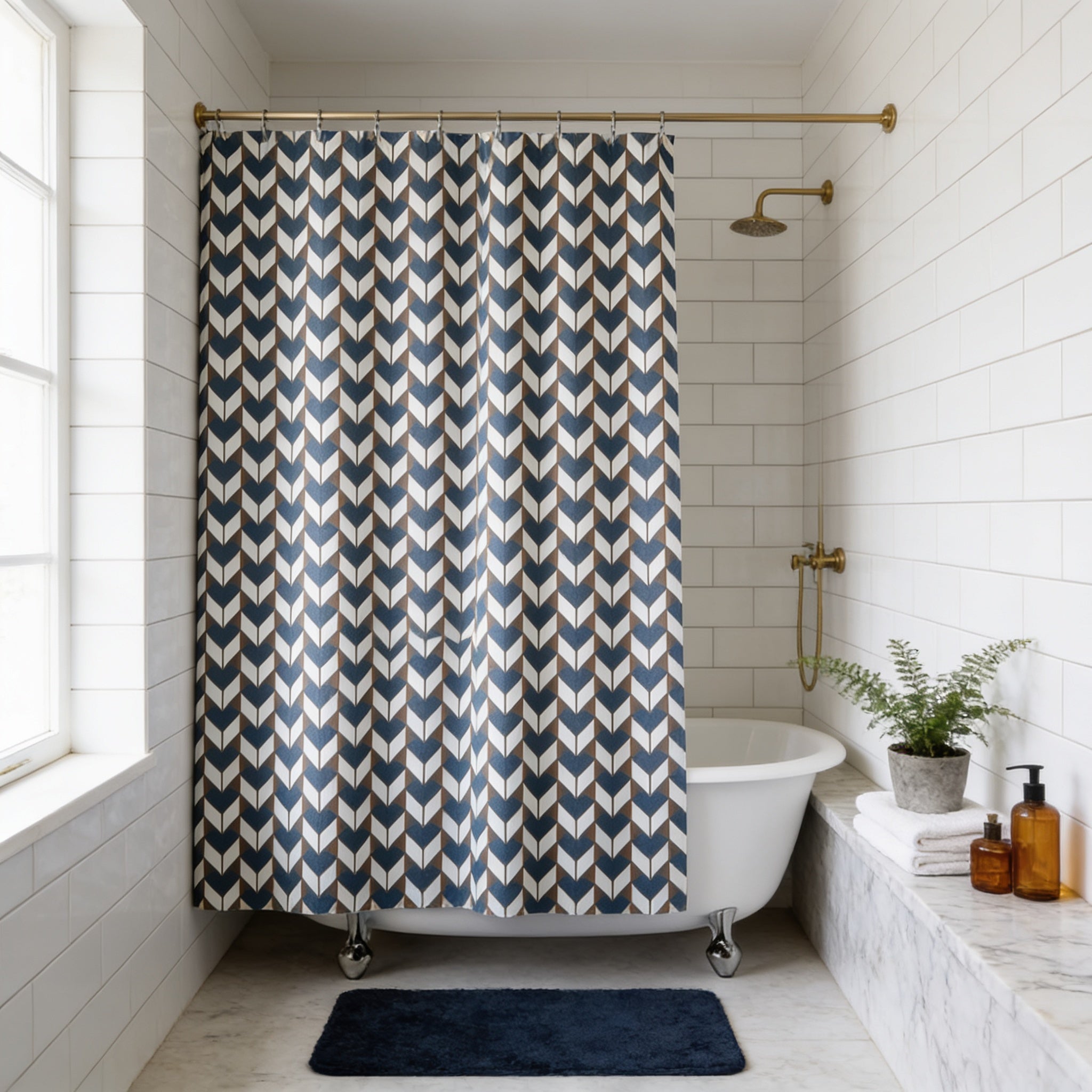 a modern bathroom with a white clawfoot bathtub, a blue and white patterned shower curtain, and a marble countertop.