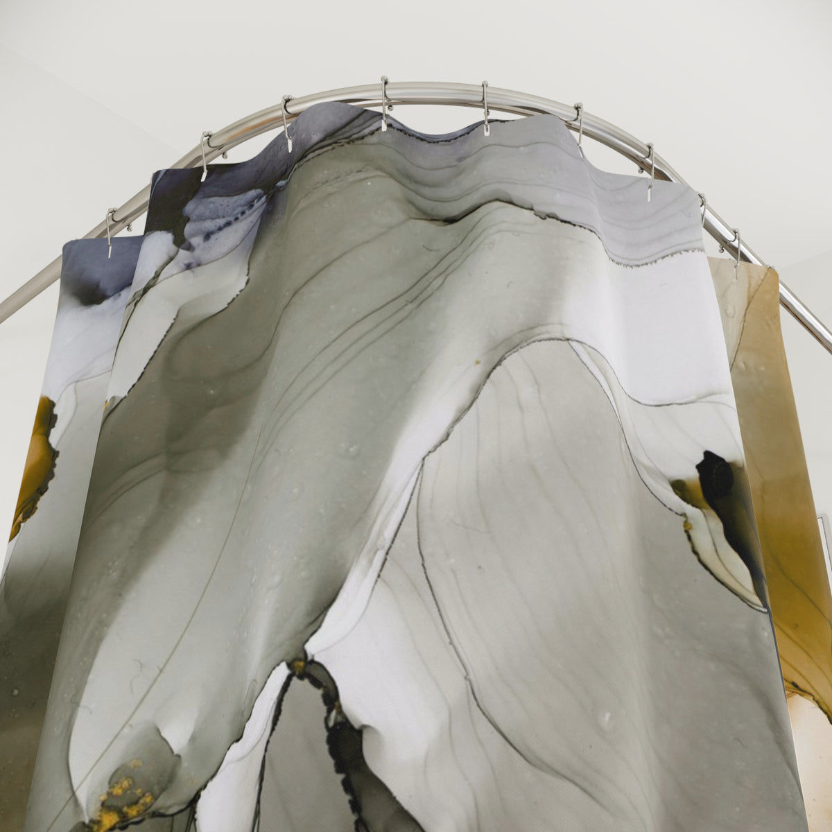 a large abstract painting with a mix of gray, white, and yellow colors, hanging from a curved metal rod.