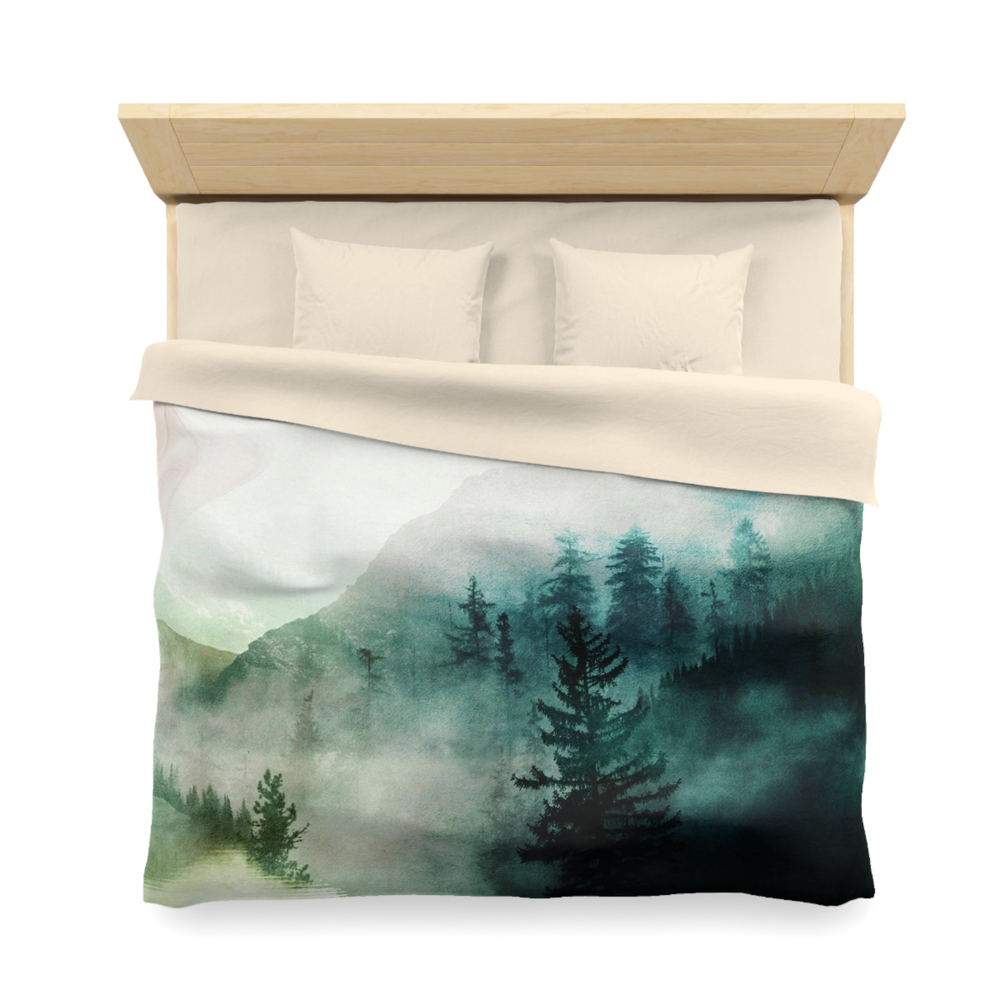 a bed with a white comforter and a printed design of a forest scene on the bedspread.