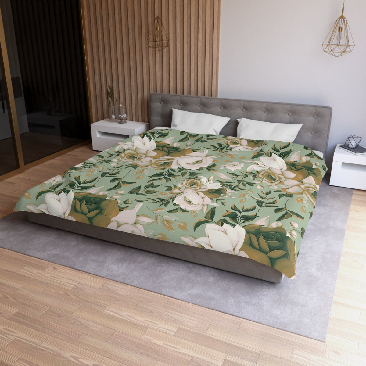 a modern bedroom with a large bed covered in a floral print bedspread. The bed is positioned against a wall with a wooden paneling. The room also features a nightstand, a pendant light, and a vase on a surface.