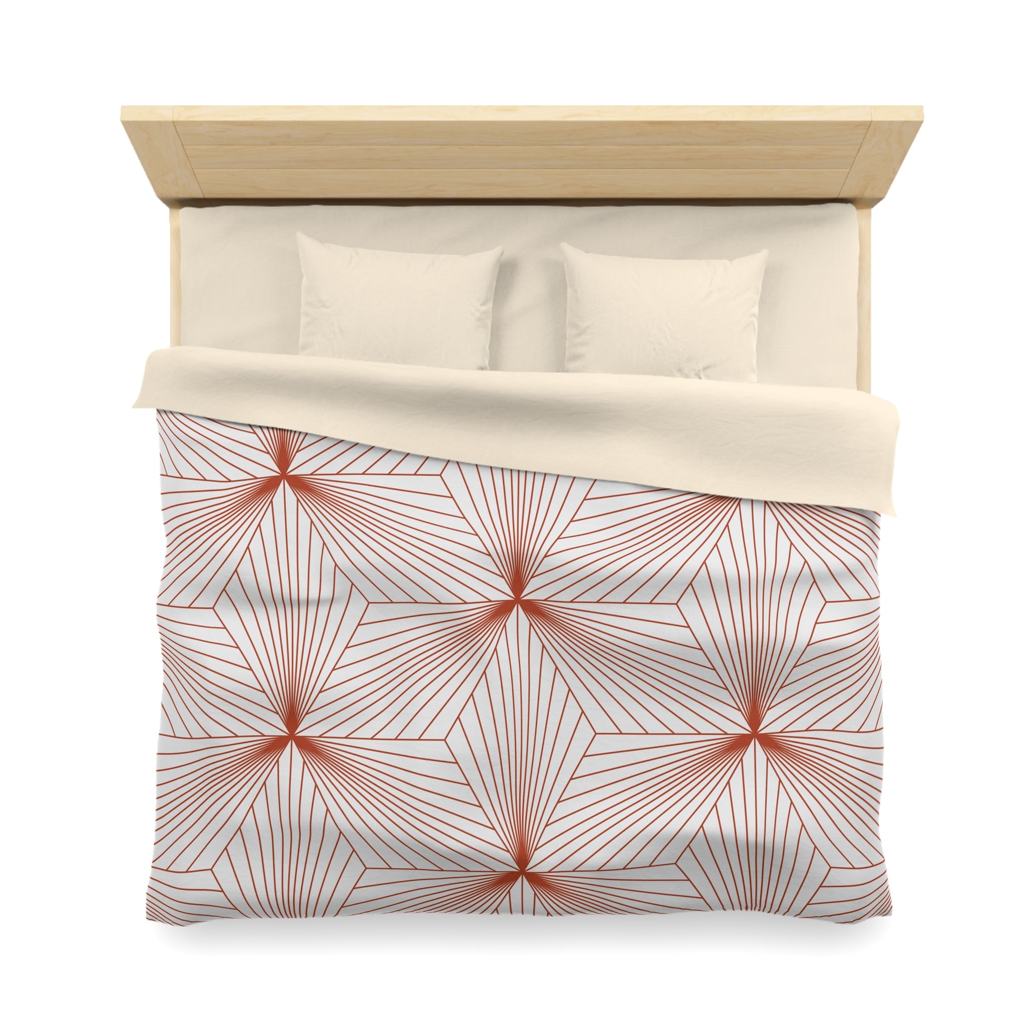 a neatly made bed with a geometric patterned comforter and pillows.