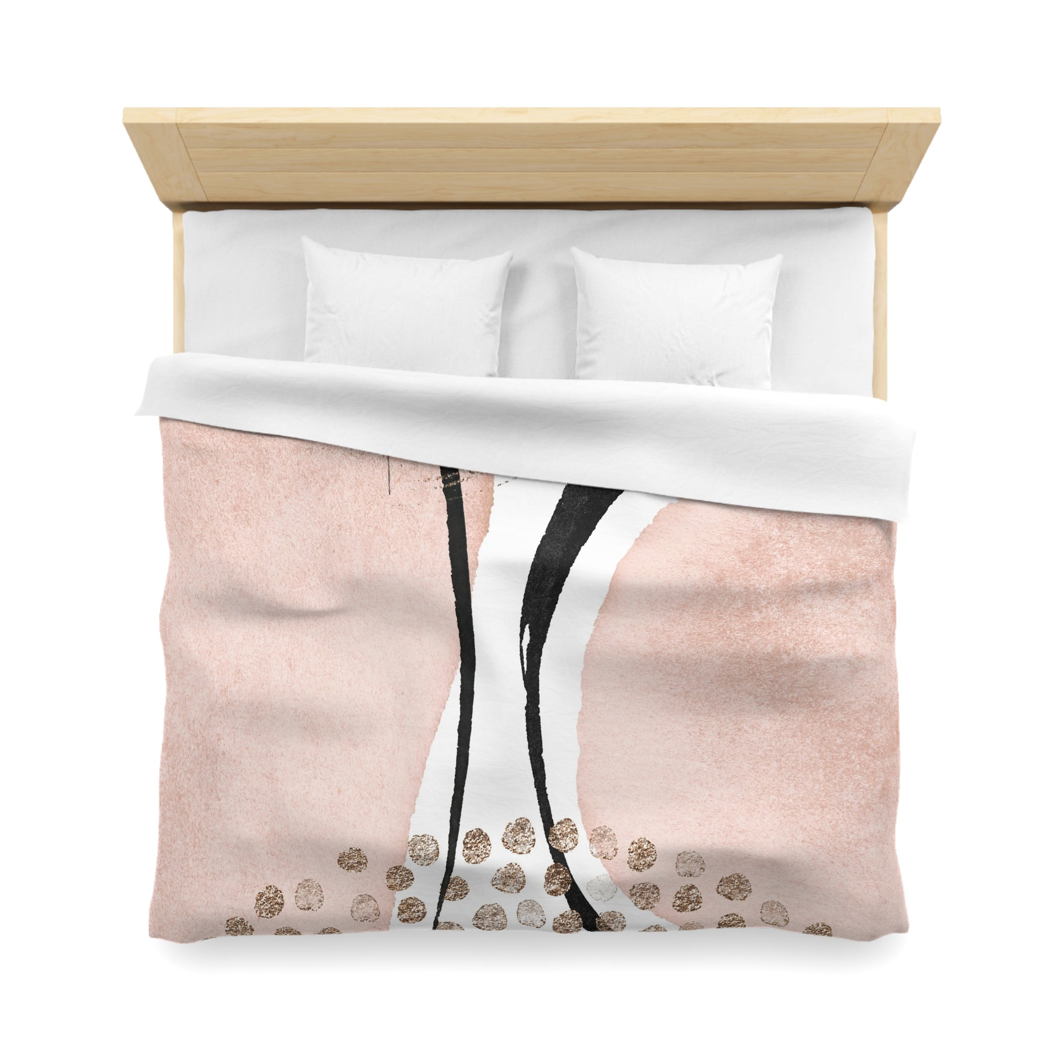 a bed with a pink and white comforter and a wooden headboard.