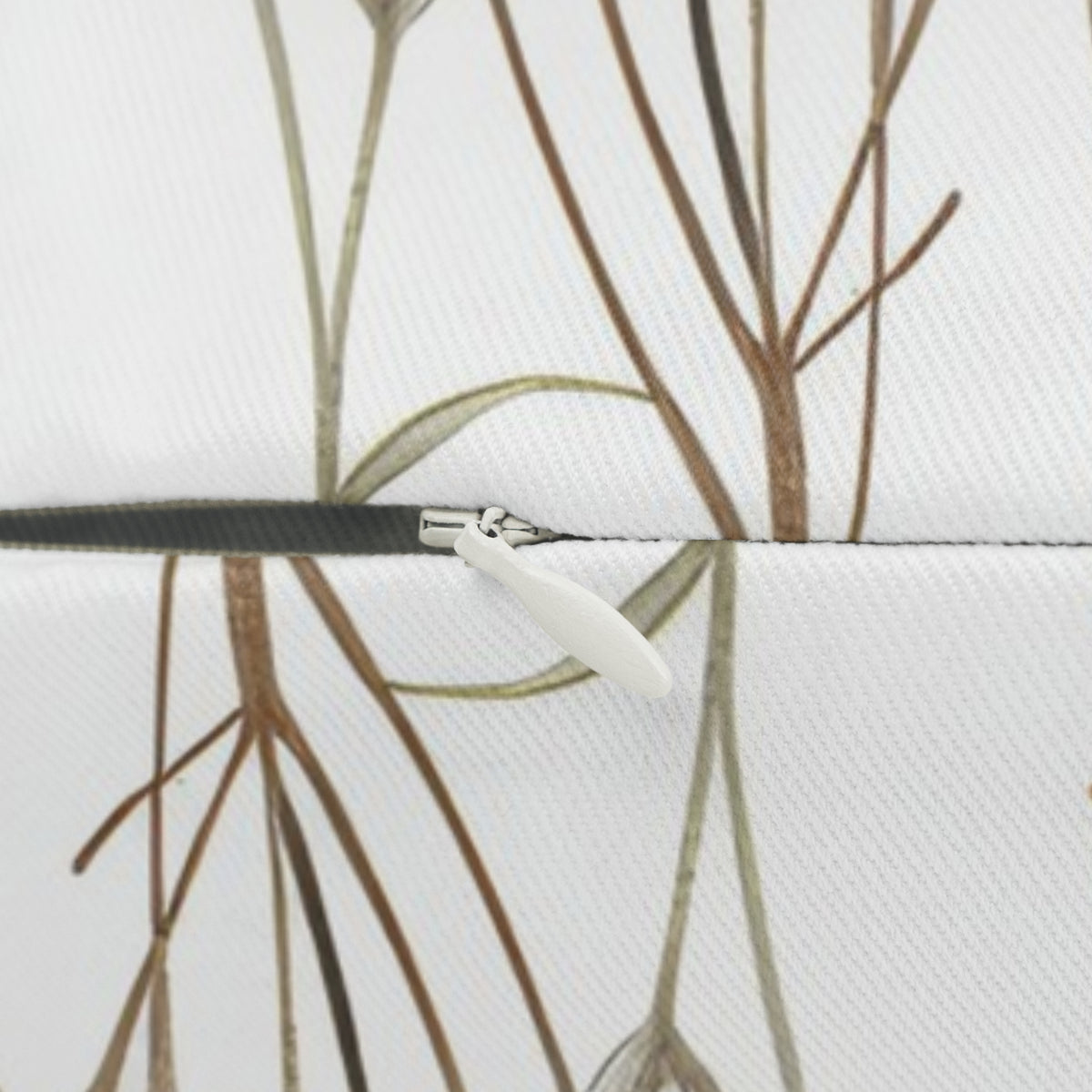 a close-up view of a zipper on a fabric, with a pattern of brown and green lines.