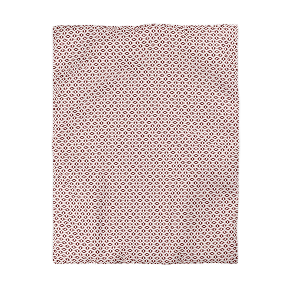 a rectangular fabric with a repeating pattern of small white diamonds on a pink background.