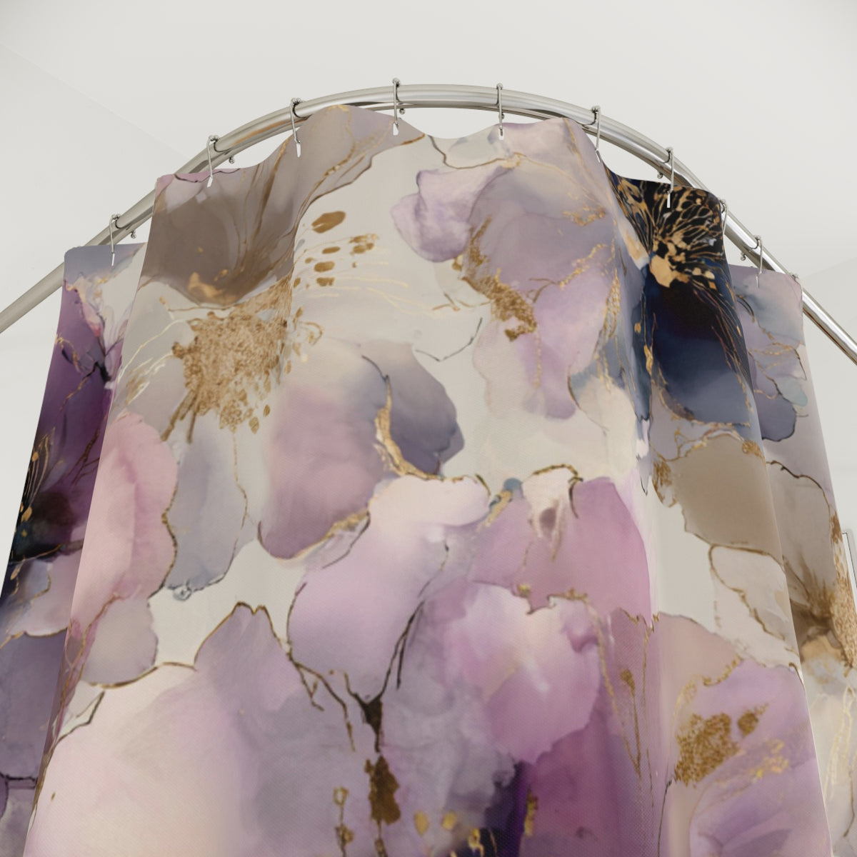 a shower curtain with a floral pattern in shades of purple and gold.