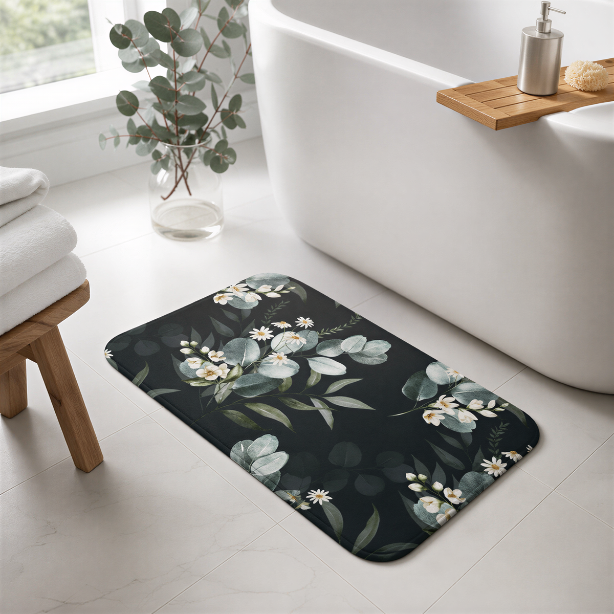 a bathroom with a black and white floral patterned bath mat on the floor, a white bathtub, and a wooden stool.