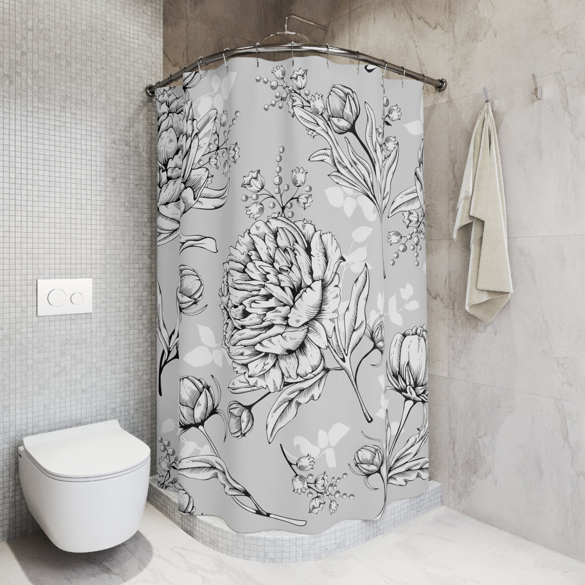 a bathroom with a shower curtain adorned with a floral pattern. The shower curtain is hanging in a corner of the bathroom, and there is a towel hanging on the wall next to it. The bathroom has a white toilet and a tiled wall, creating a clean and modern aesthetic.