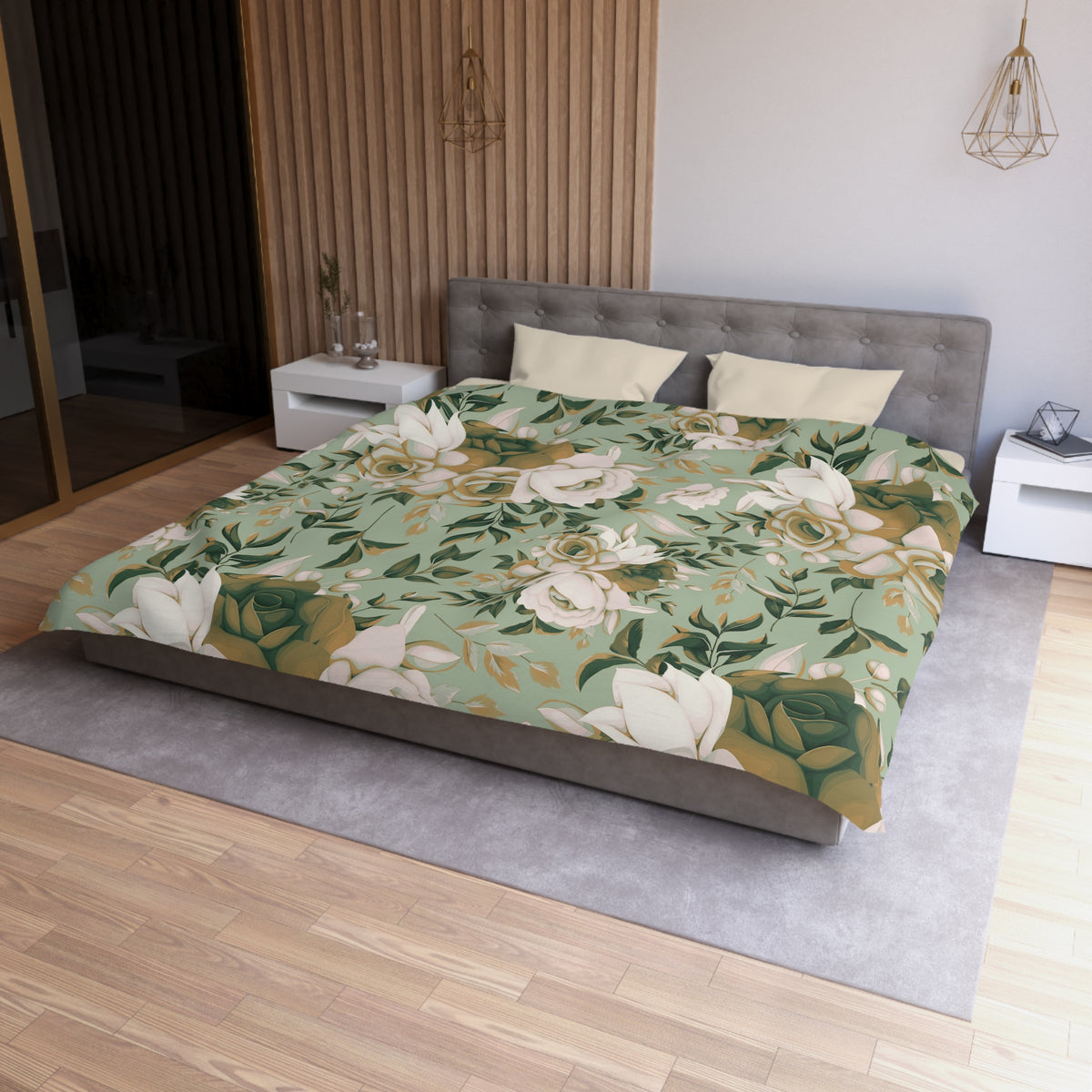 a modern bedroom with a large bed covered in a floral print bedspread. The bed is positioned against a wall with a wooden paneling. The room also features a nightstand, a pendant light, and a vase on a surface.