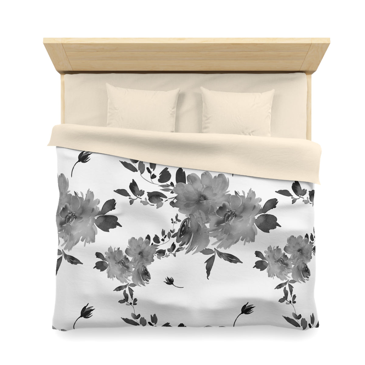 a neatly made bed with a floral print comforter and pillows.