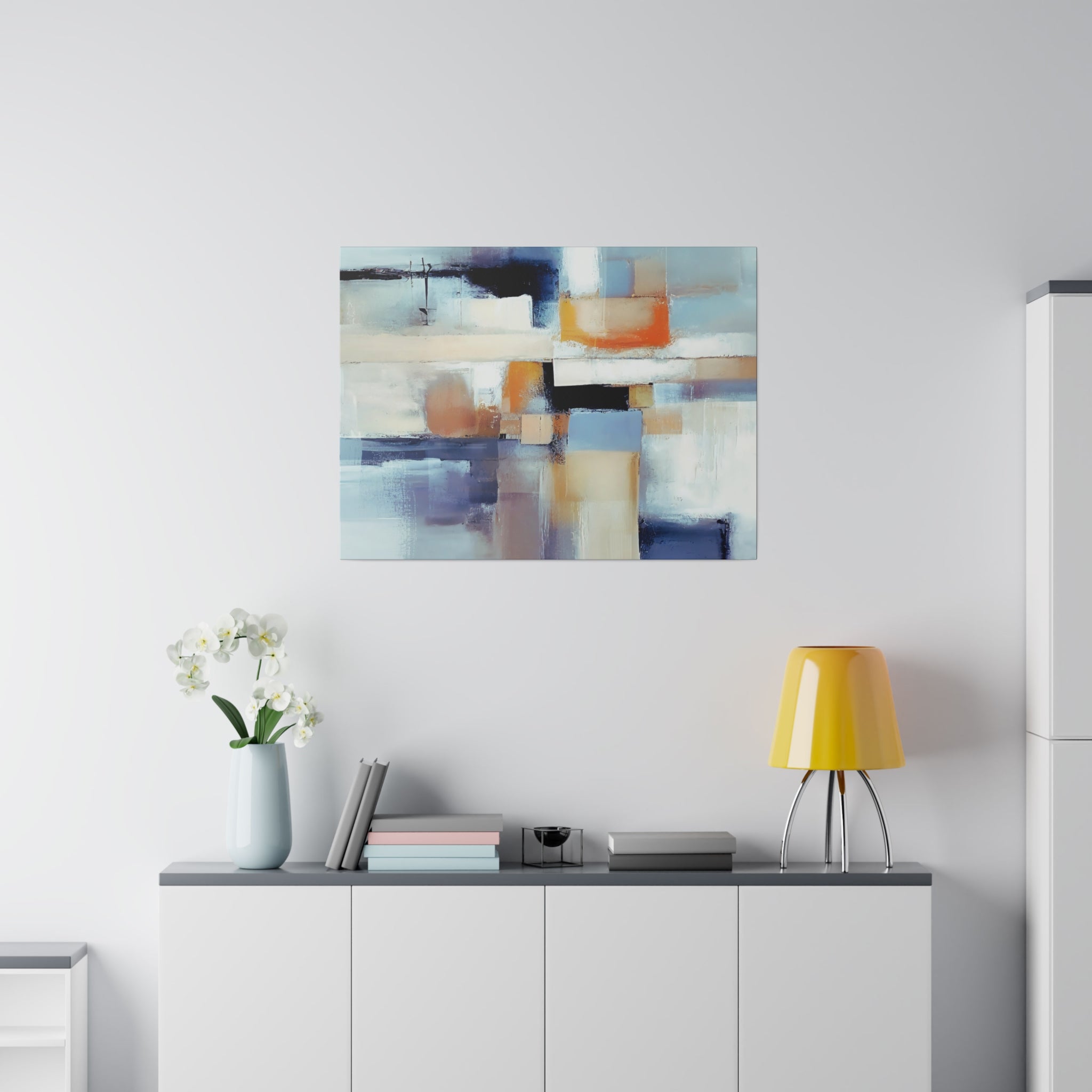Blue and beige abstract canvas wall art displayed on a living room gallery wall
