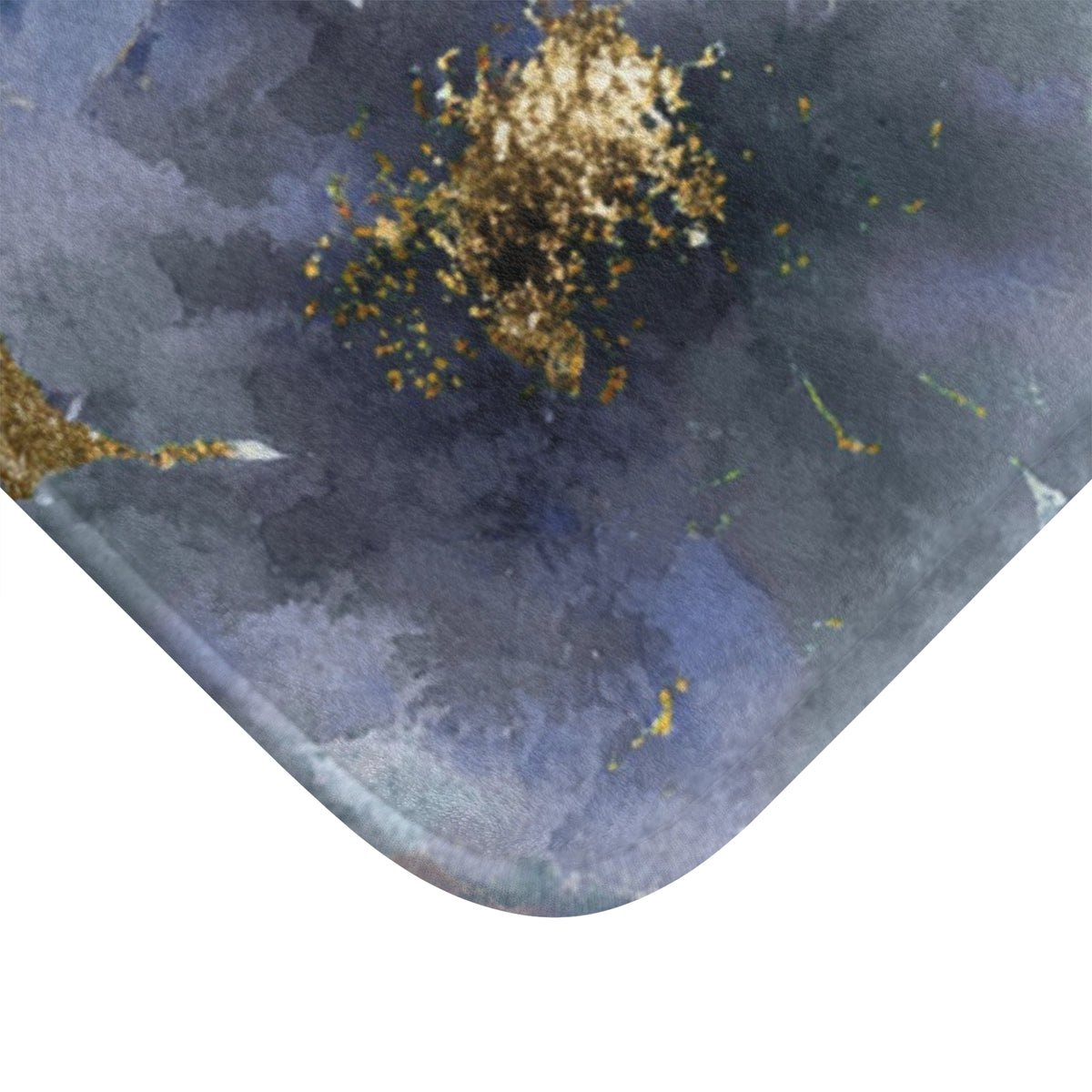 a close-up view of a textured surface with a blue and gold color scheme. The surface appears to be a mat or rug, with a pattern of blue and gold elements. The image does not contain any text or other discernible objects or actions.