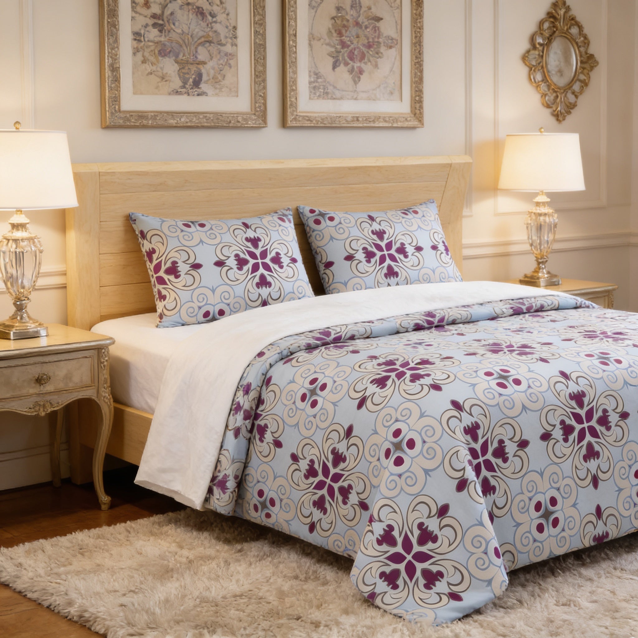 a well-decorated bedroom with a large bed, a wooden headboard, and two lamps on either side of the bed. The bed is covered in a blue and white floral comforter, and the room has a neutral color scheme with white walls and a beige rug.