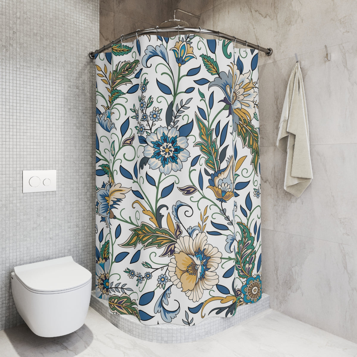 a bathroom with a shower curtain adorned with a floral pattern in shades of blue, green, and yellow. The shower curtain is hanging on a rod next to a towel. The bathroom also includes a toilet and a sink.