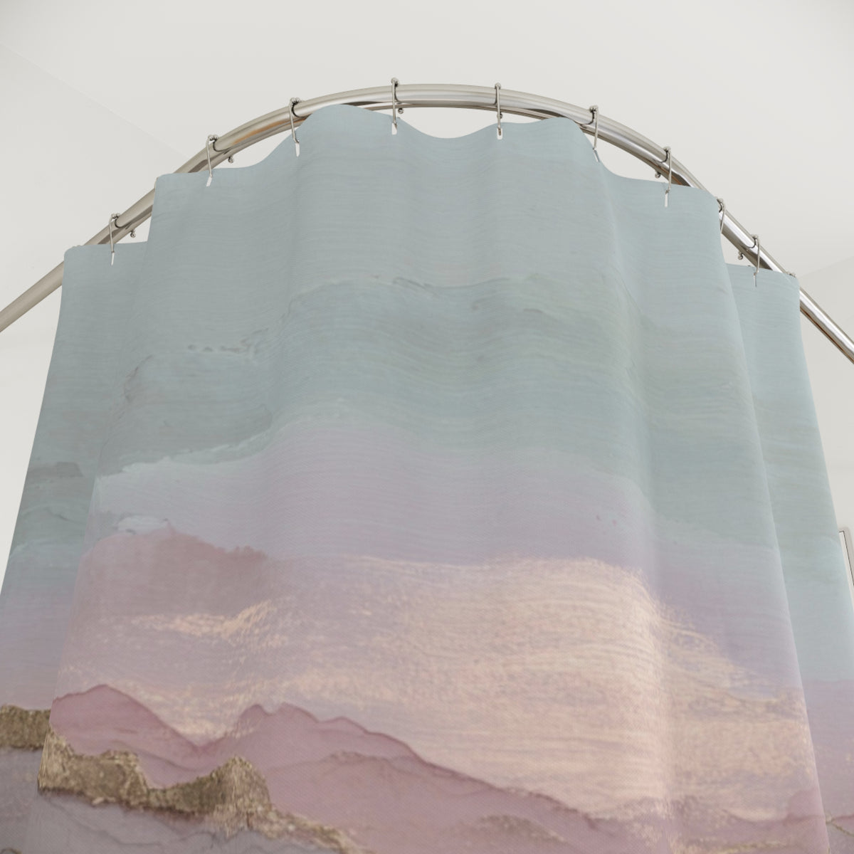 a curved shower curtain with a landscape design, including mountains and a body of water.