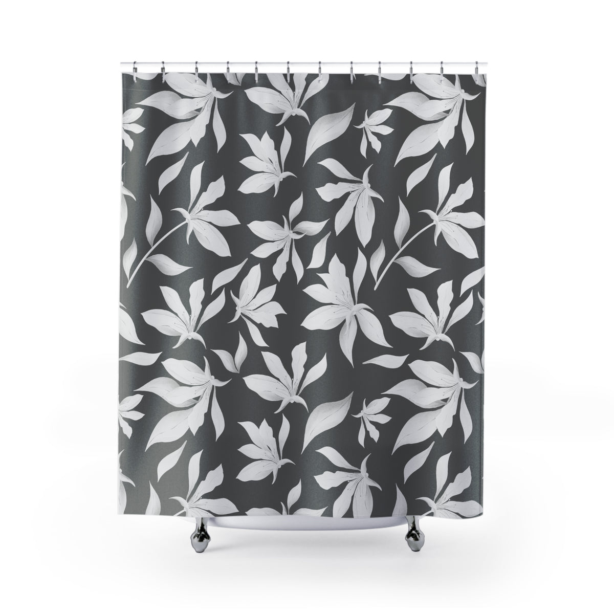 a shower curtain with a black and white leaf pattern.