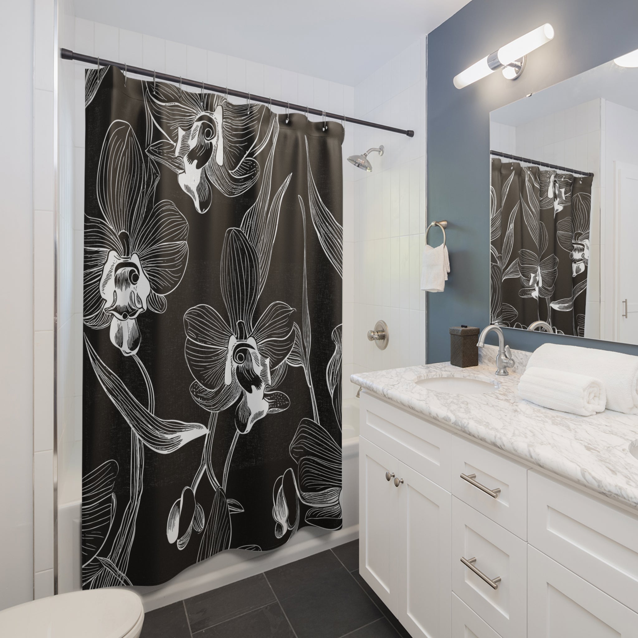 a bathroom with a black and white shower curtain
