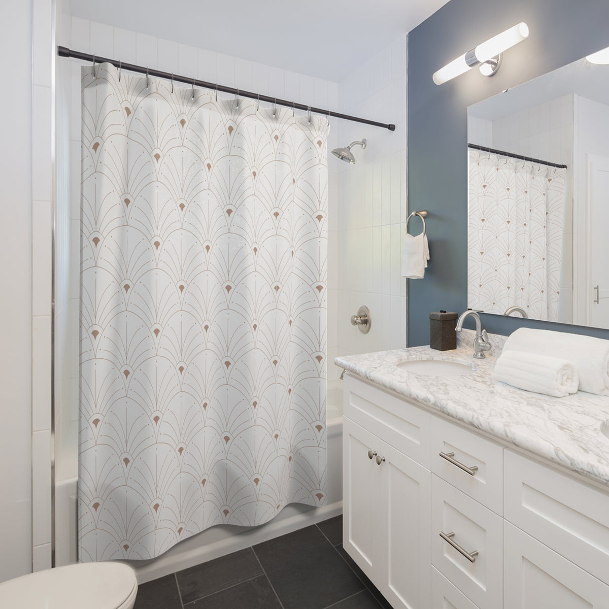 a modern bathroom with a white vanity, a shower curtain with a repeating pattern, and a mirror above the sink.