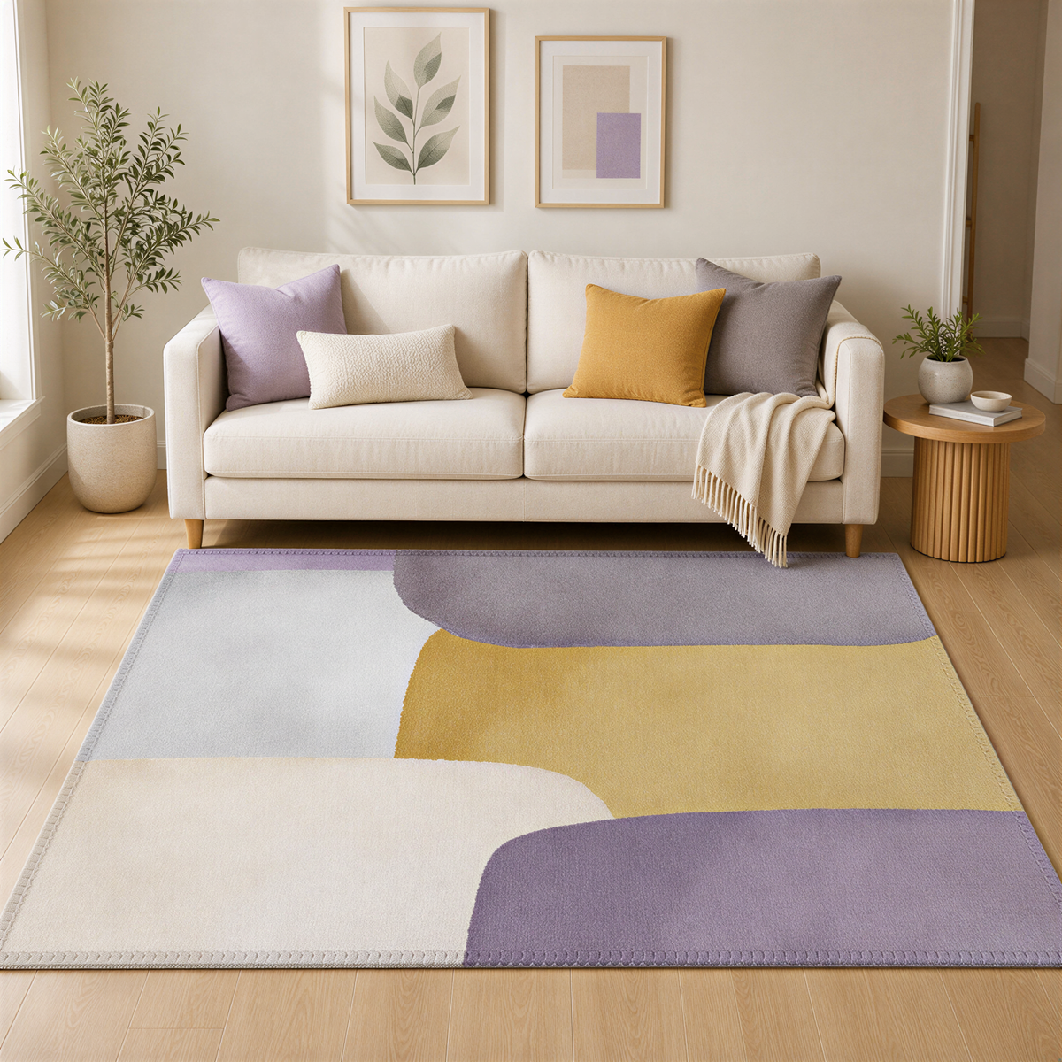 a cozy living room with a beige sofa, a colorful abstract rug, and two framed pictures on the wall.