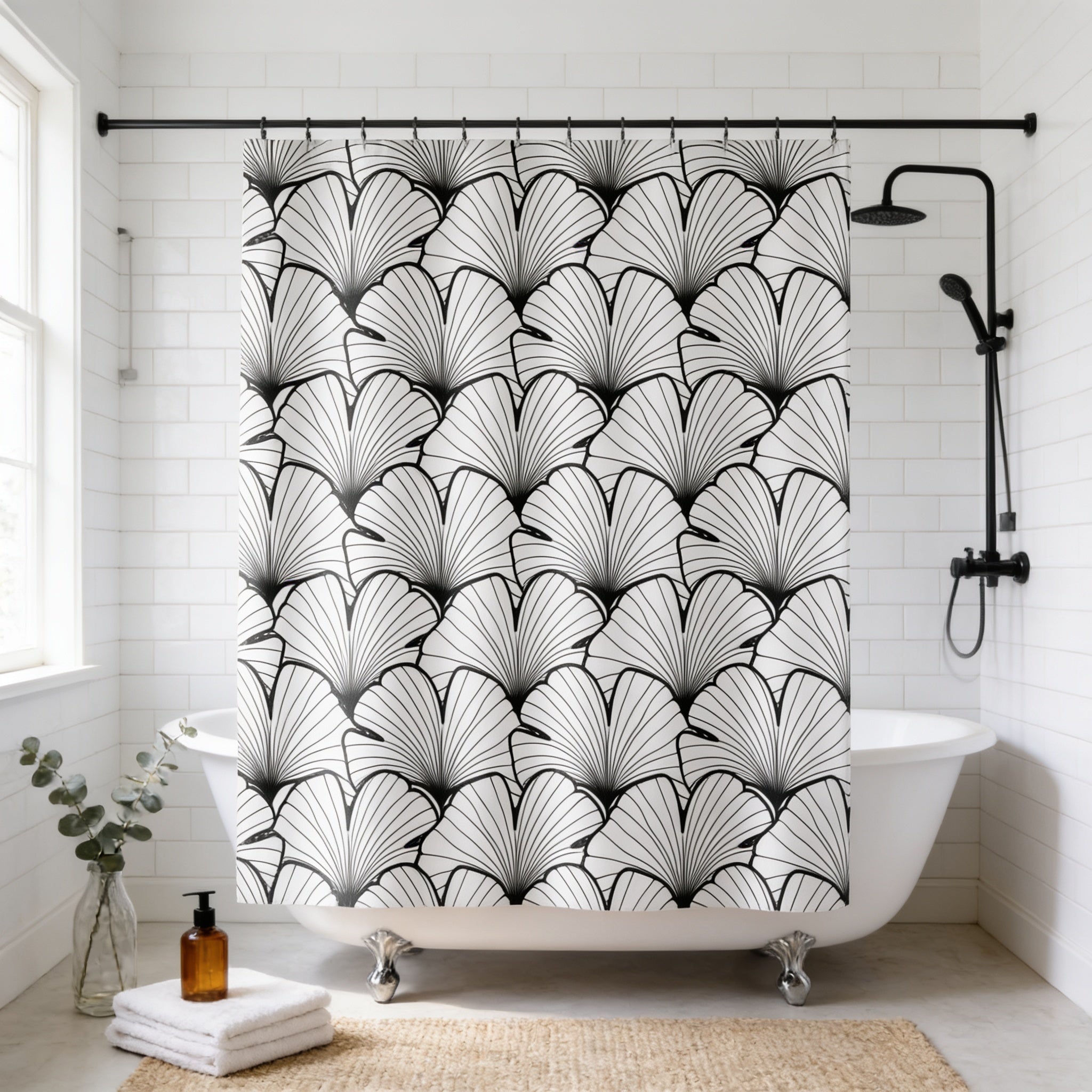 a bathroom with a white bathtub, a shower curtain with a black and white leaf pattern, and a bottle of soap on the floor.