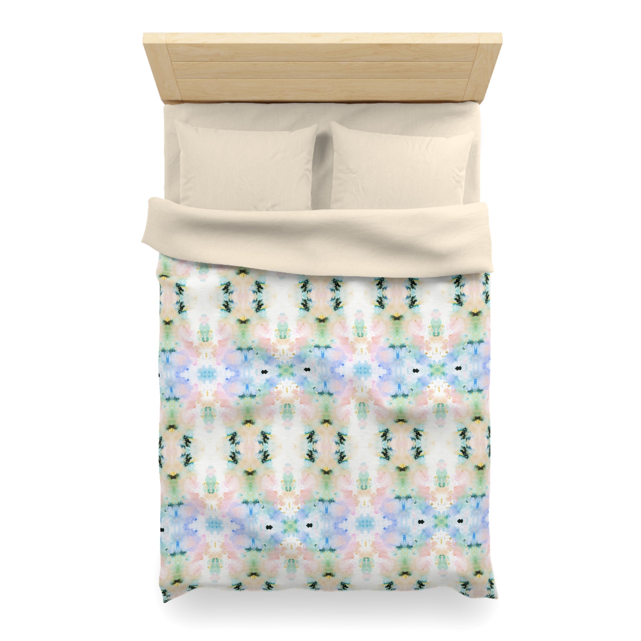 a neatly made bed with a colorful, patterned comforter and pillows.