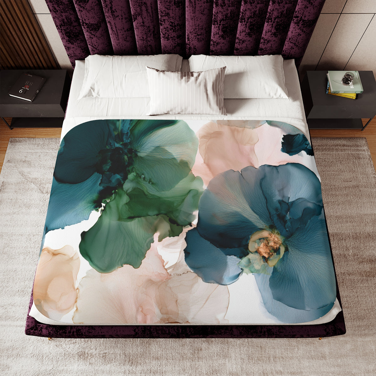 a bed with a floral comforter and pillows