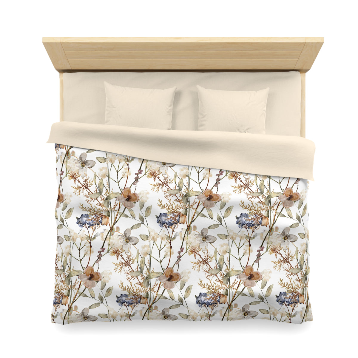 a neatly made bed with a floral print comforter and pillows.