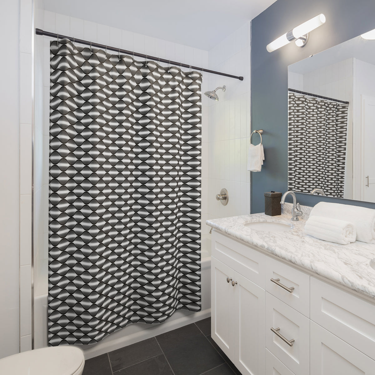 a modern bathroom with a white vanity, a black and white patterned shower curtain, and a mirror above the sink.