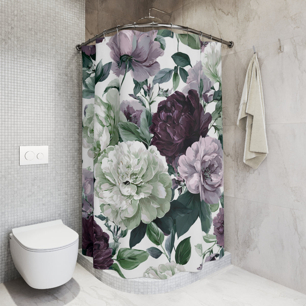 a bathroom with a shower curtain adorned with a floral pattern in shades of purple and white. The shower curtain is hanging from a rod, and there is a towel hanging on the wall next to it. The bathroom has a white toilet and a tiled wall, creating a clean and modern aesthetic.
