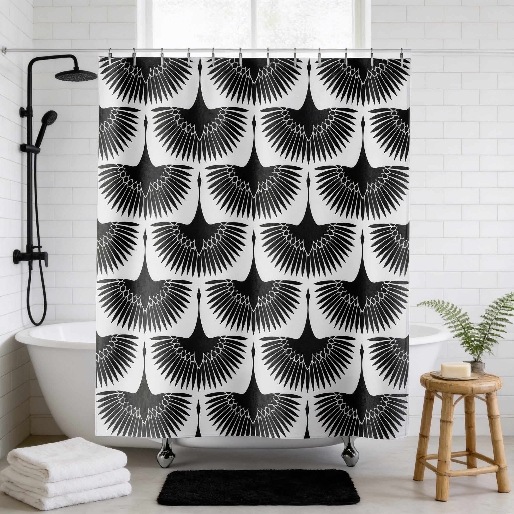a bathroom with a shower curtain adorned with a repeating pattern of black birds. The shower curtain is hanging from a rod, and there is a white bathtub in the background. A small potted plant is placed on the floor next to the bathtub, and a wooden stool is situated nearby.