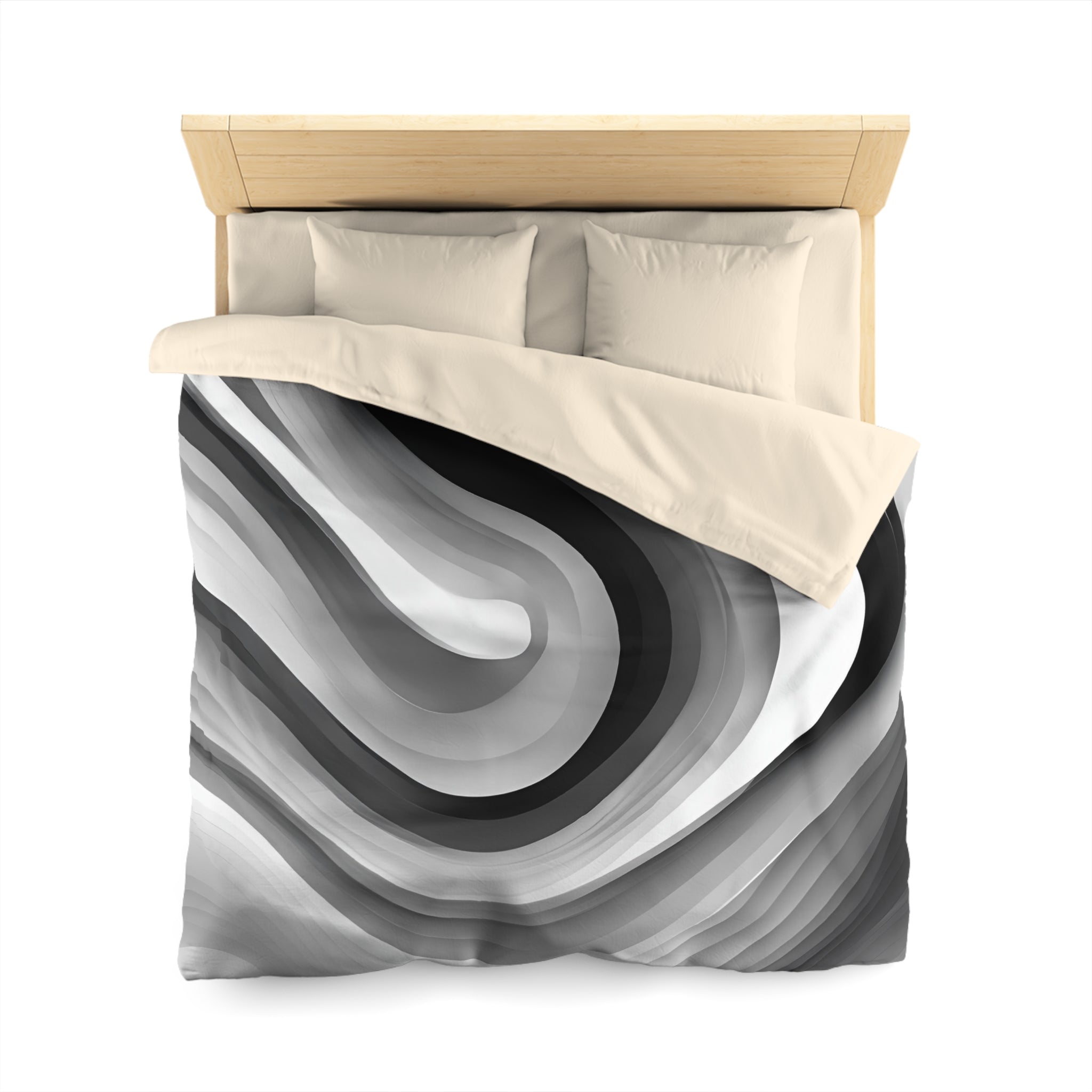 a bed with a black and white abstract design on the comforter, including curved lines and shades of gray and white.