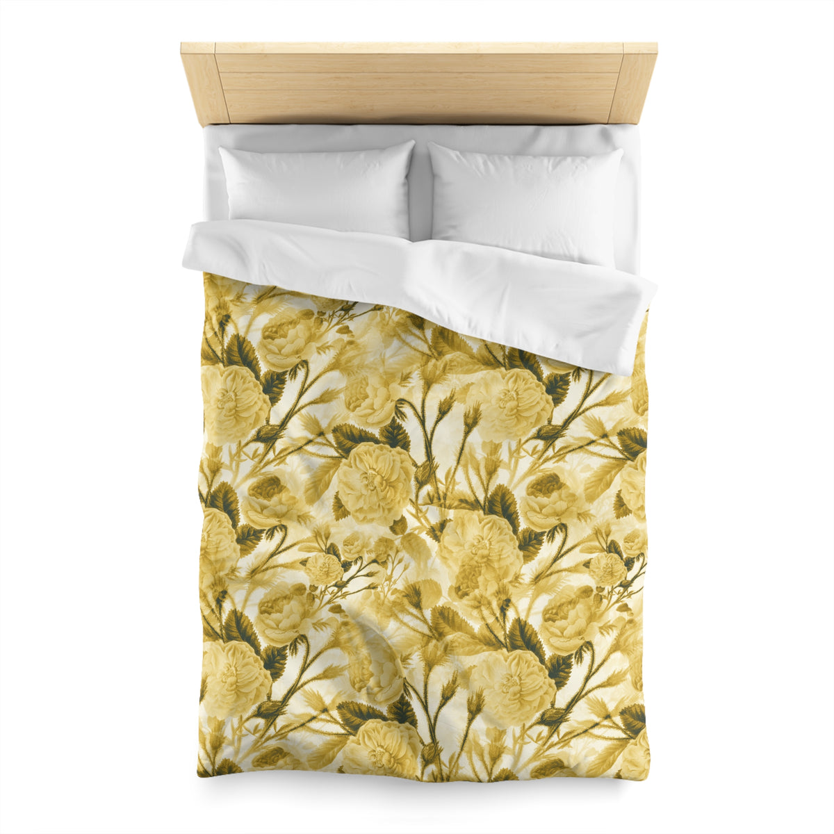 a bed with a yellow and green floral print duvet cover and white pillows.