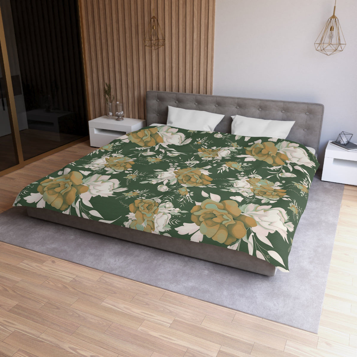 a modern bedroom with a large bed covered in a floral print bedspread. The bed is positioned against a wall with a wooden panel. The room also features a nightstand, a pendant light, and a mirror.