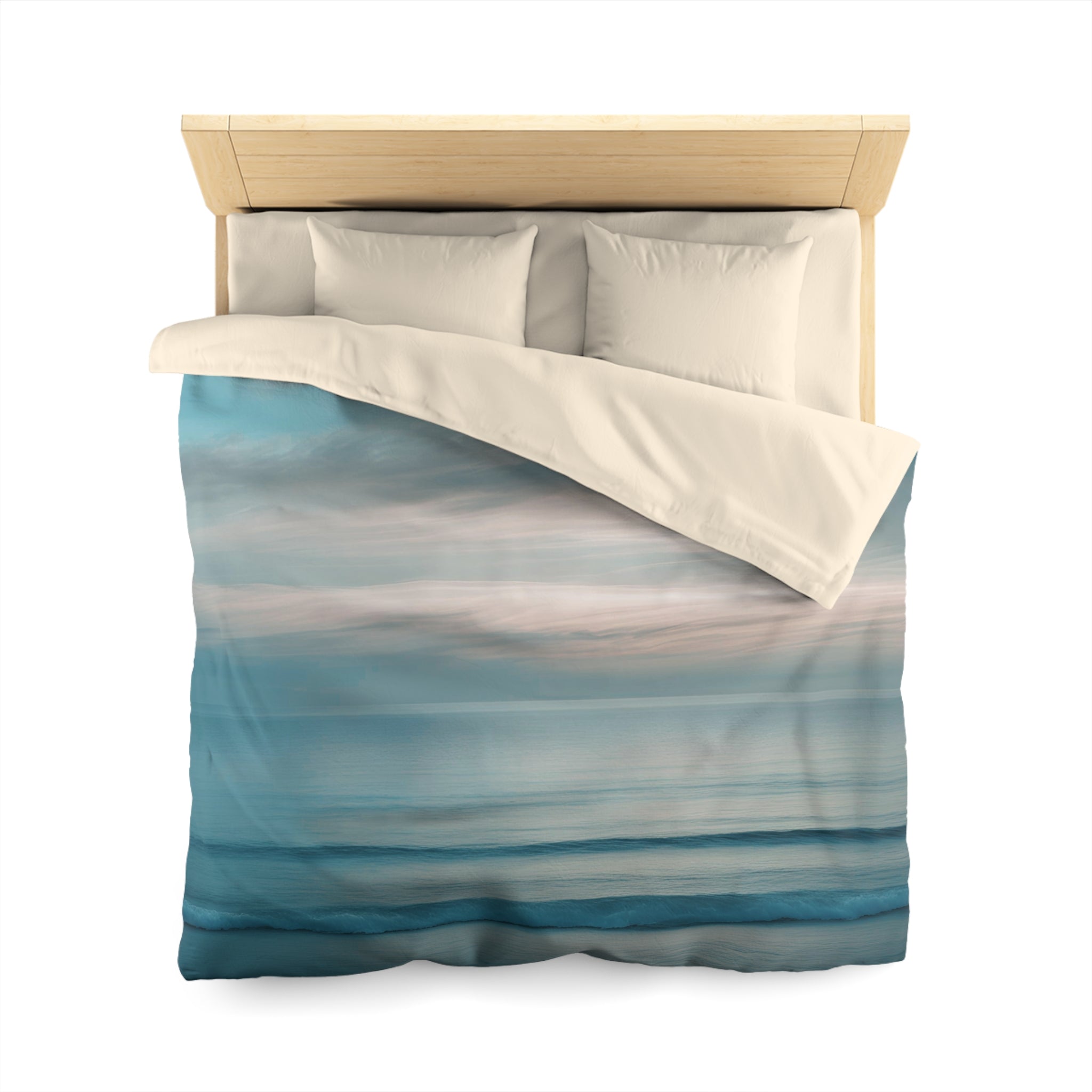 a neatly made bed with a blue and white striped comforter and pillows.
