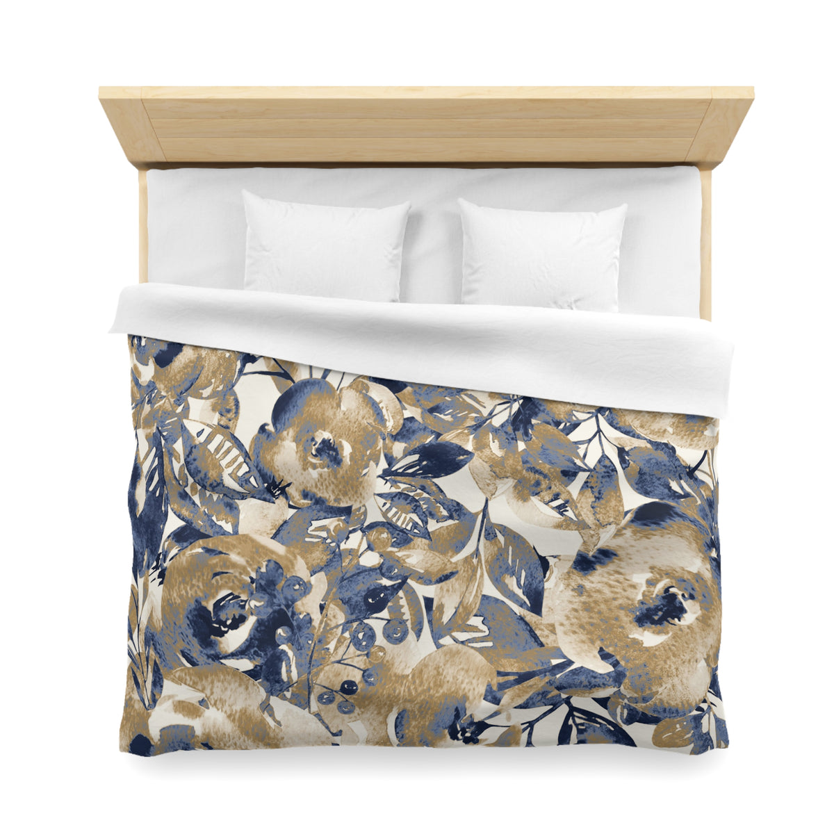 a bed with a floral print duvet cover and white pillows.