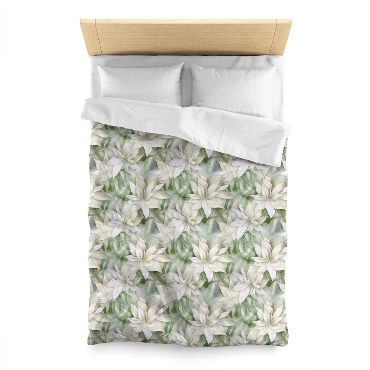a neatly made bed with a white comforter and pillows, featuring a floral pattern in shades of green and white.